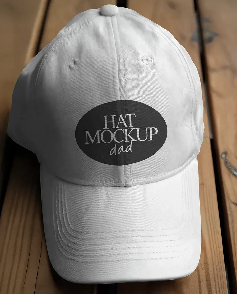 Dad hat mockup on a white cap placed on a wooden surface