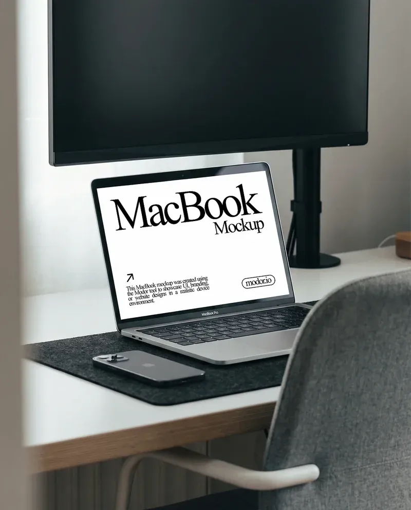 MacBook and iPhone mockup placed on a modern workspace desk with monitor